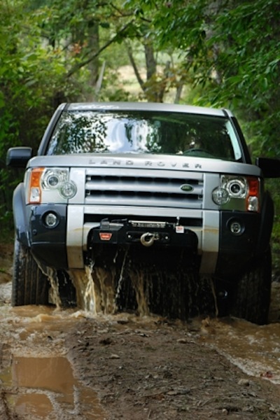 Land Rover driving through mud