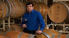 Bernard Delille standing around barrels