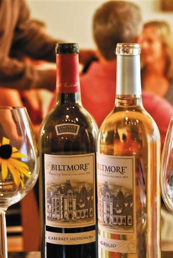 Bottles of Biltmore wine with people in the background