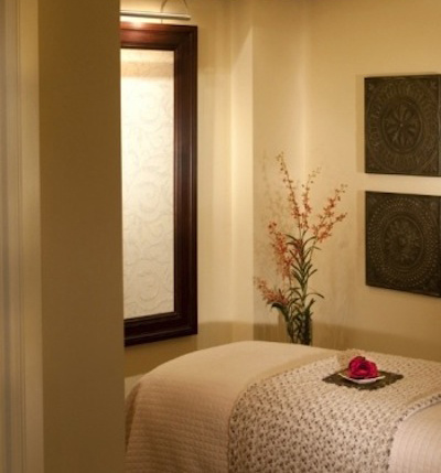 spa bed with a rose on top