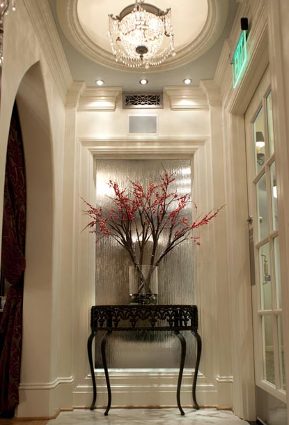 end table at end of a hallway with flowers on it