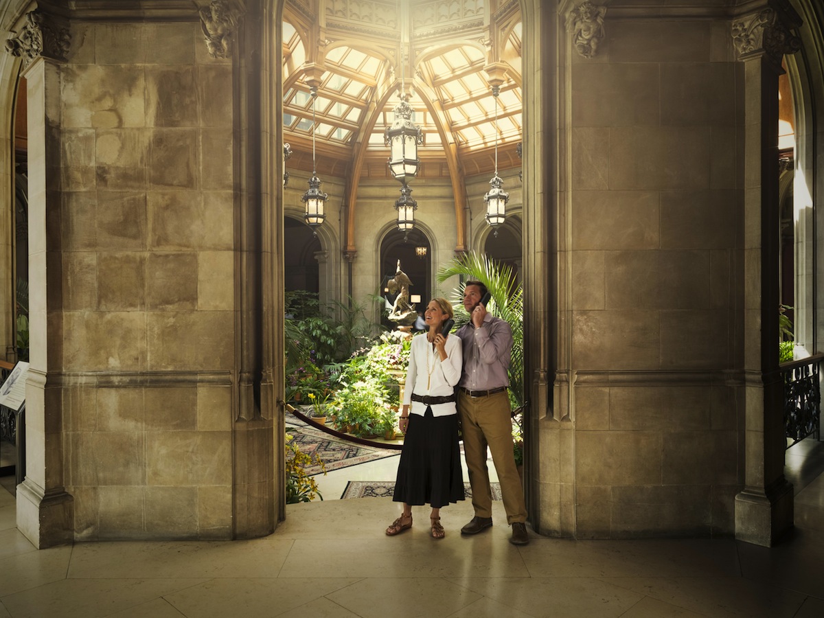 Couple on audio guide tour
