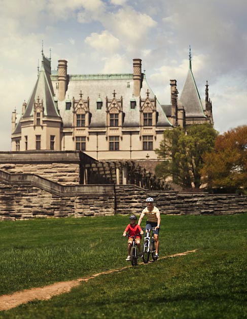 Adult and child riding bikes